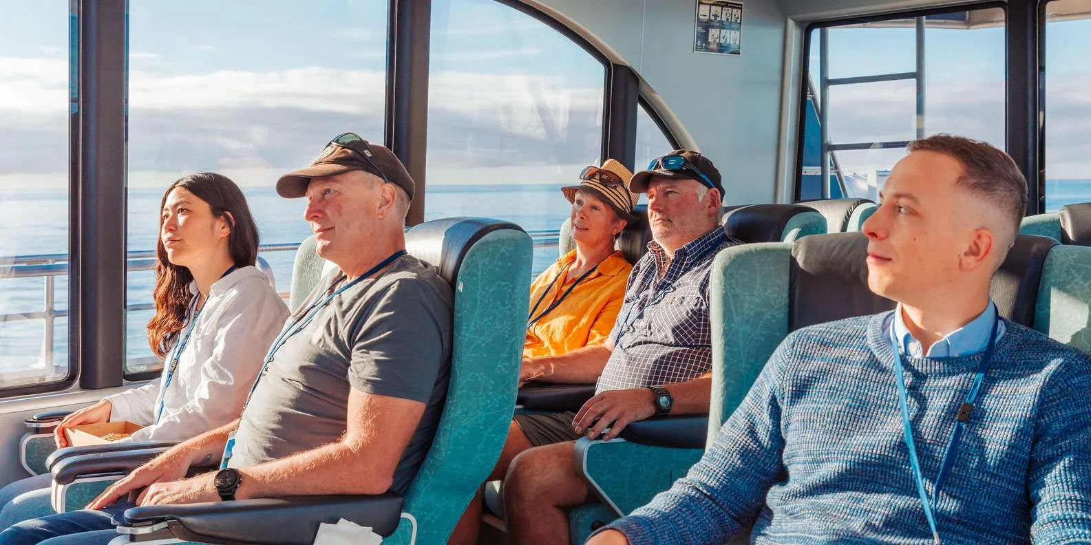 Whale watching passengers on deck of Kaikoura cruise boat